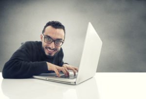 Hacker working on laptop